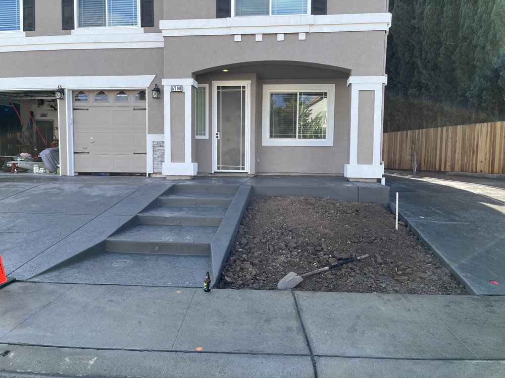 New concrete driveway, steps, and walkway installation at residential home in Elk Grove
